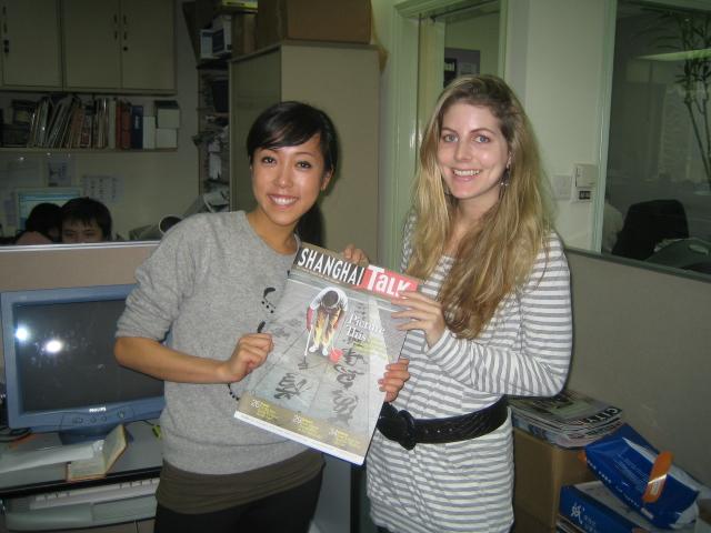 A Projects Abroad intern showcases a magazine A journalism intern in China holds up a magazine at her placement